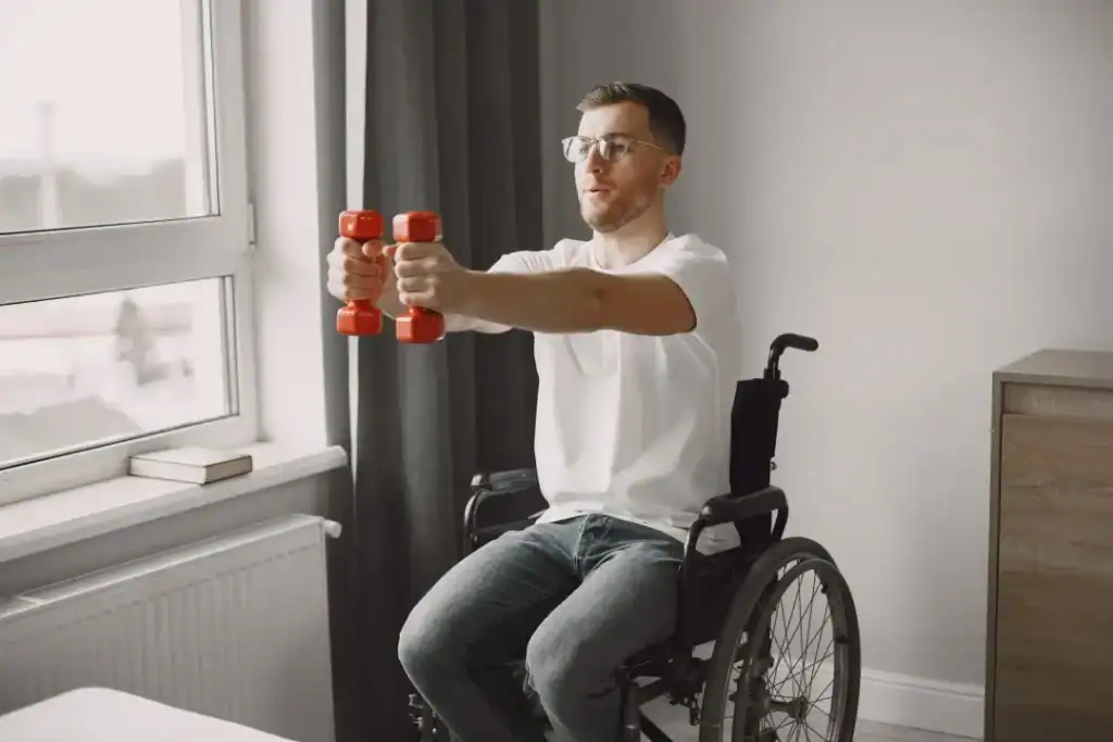 Image of man doing exercise in his wheelchair to aid weight loss Crawley